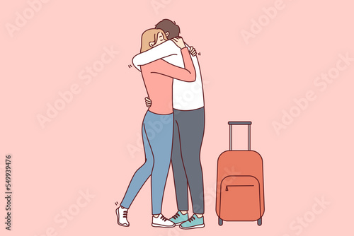 Canvas Print Woman hugging man with suitcase meet lover in airport