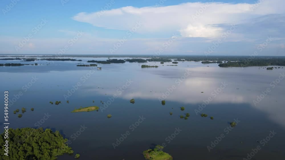 Submerged flooded area created small islands in Bangladesh. Aerial view. Drone fly forward shot Submerged flooded area created small islands in Bangladesh. Aerial view. Drone fly forward shot