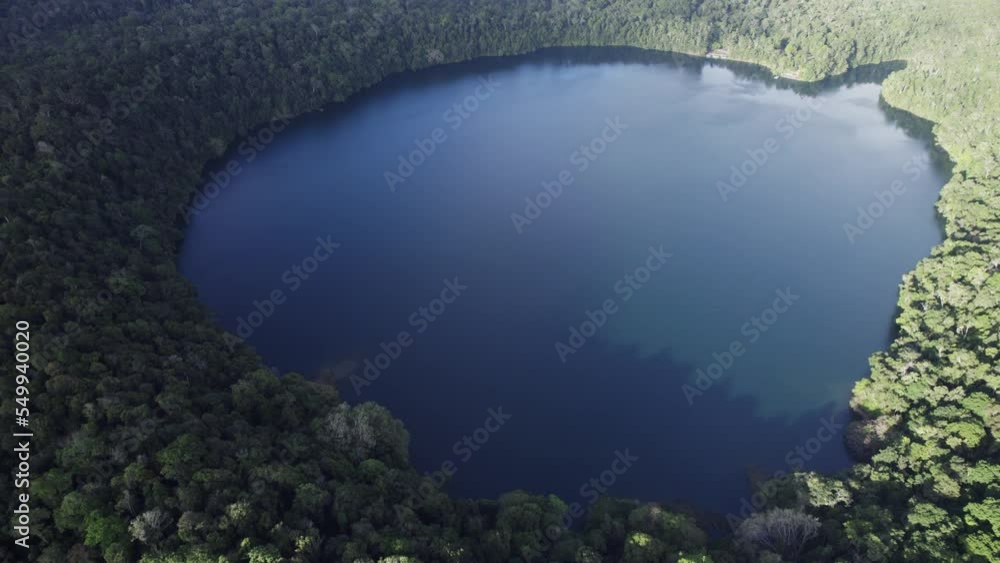 View Of Volcanic Crater Lake From Above - Lake Eacham In Atherton Tableland, Queensland, Australia - drone shot View Of Volcanic Crater Lake From Above - Lake Eacham In Atherton Tableland, Queensland, Australia - drone shot