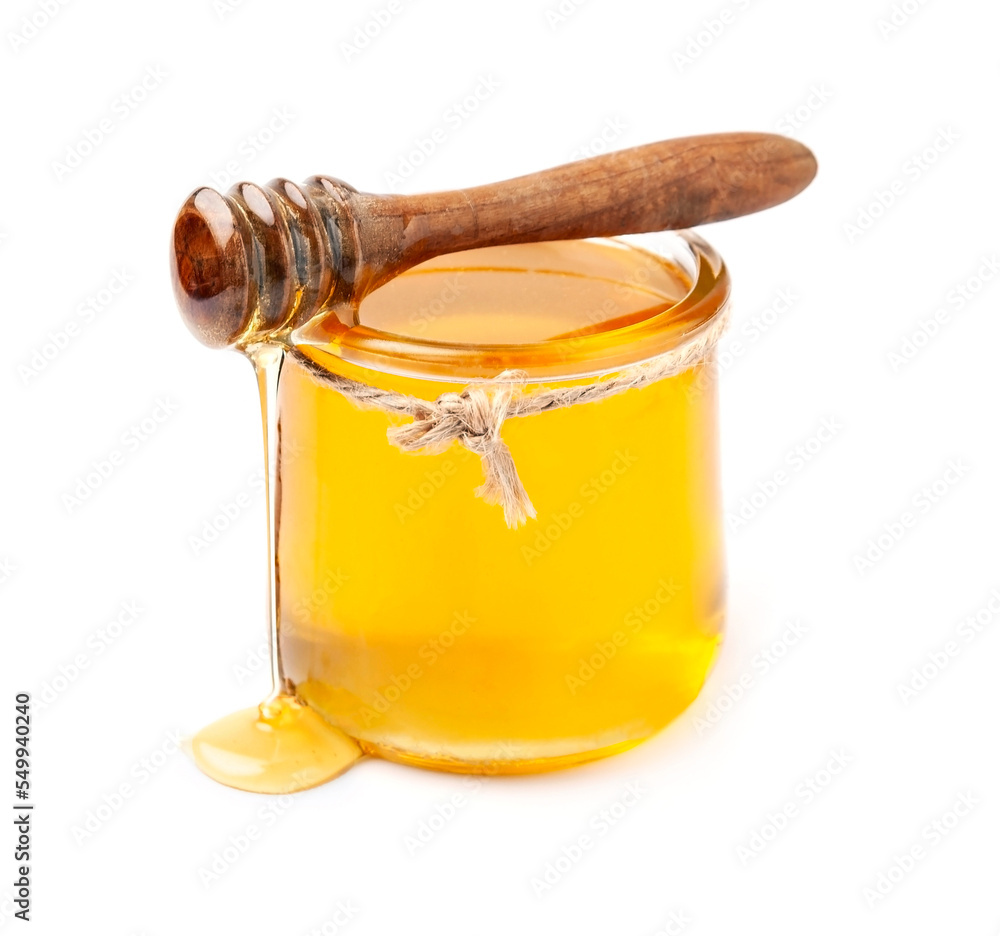 Honey and wooden honey dipper on white backgrounds Honey and wooden honey dipper on white backgrounds