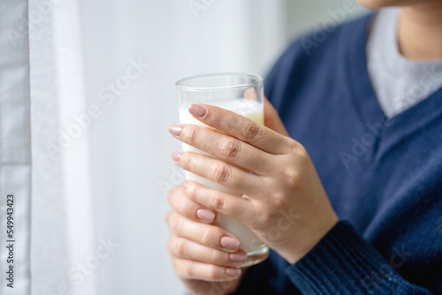 Young woman drinking milk healthy morning, good health concept.