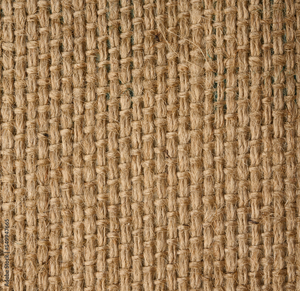 Texture of brown burlap, rough fabric with fibers for bags, macro Texture of brown burlap, rough fabric with fibers for bags, macro