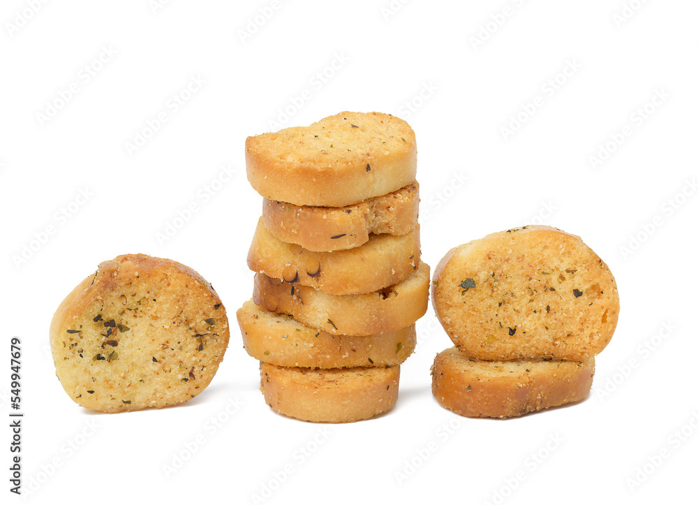 A pile of round bread croutons with spices on a white isolated background. Snack A pile of round bread croutons with spices on a white isolated background. Snack