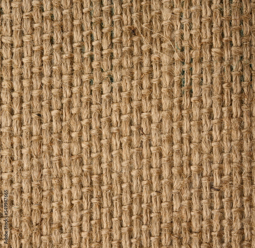 Texture of brown burlap, rough fabric with fibers for bags, macro