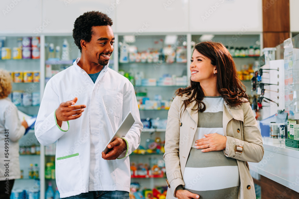 Fototapeta premium Pregnant woman with pharmacist.