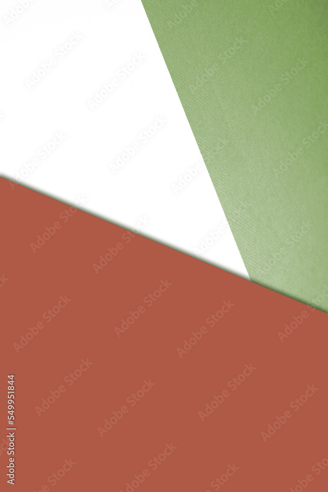 Plain vs textured coloured papers intersecting to form a triangle shape for cover design	