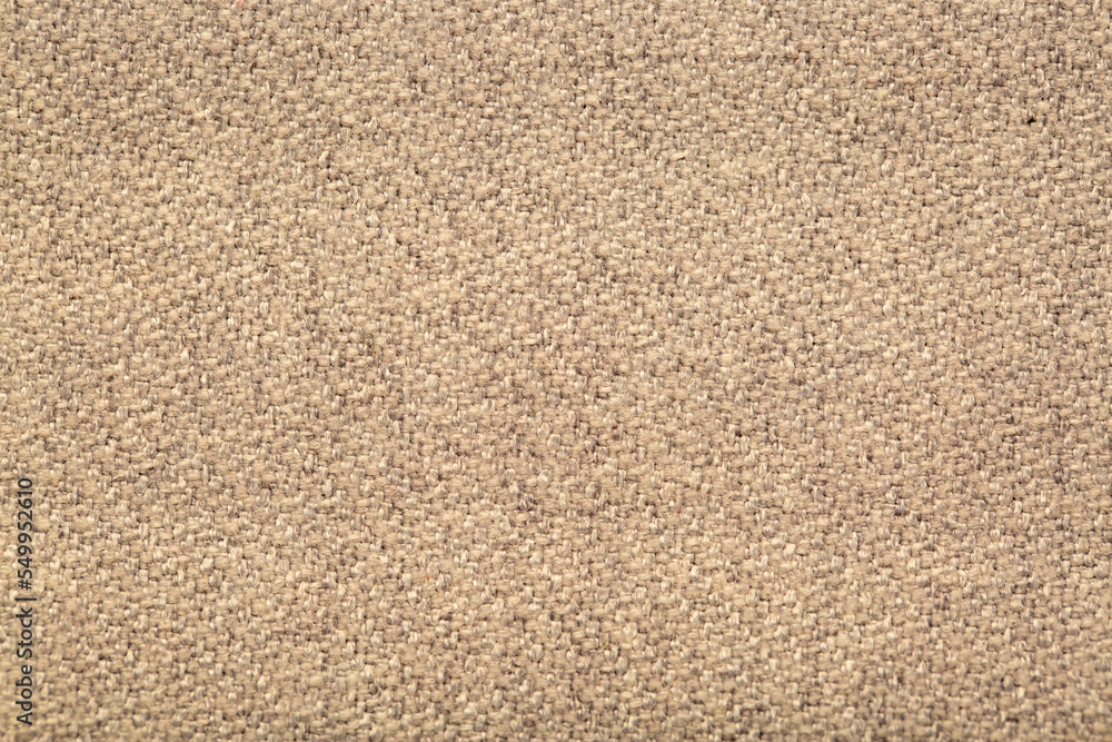 Close-up fabric swatches as a background. The texture of the material with patterns of weaving close-up. Upholstery fabric for interior decoration. Close-up fabric swatches as a background. The texture of the material with patterns of weaving close-up. Upholstery fabric for interior decoration.