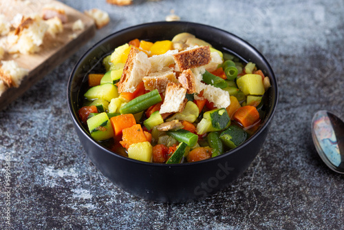 Minestrone with mixed vegetables with croutons. Healthy and nutritious dish, ideal for lunch or dinner and completely plant based. Vegetables soup.
