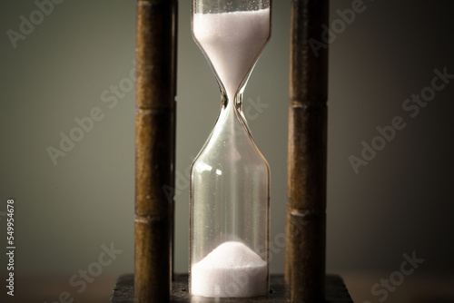 vintage tone of hourglass. passing time in a countdown sandglass with copy space for add text.