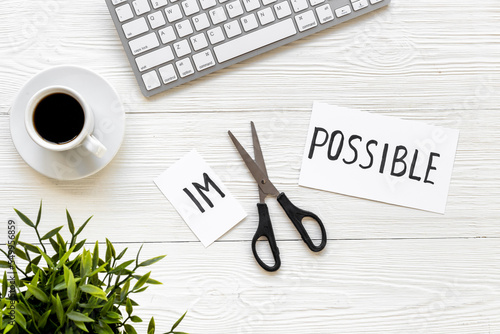 Plakat Finding solution concept. Changing word impossible to possible with scissors