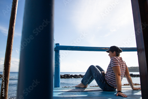 woman relaxing by the sea