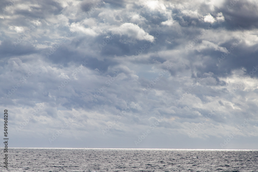 Obraz premium seascape with dark clouds and light