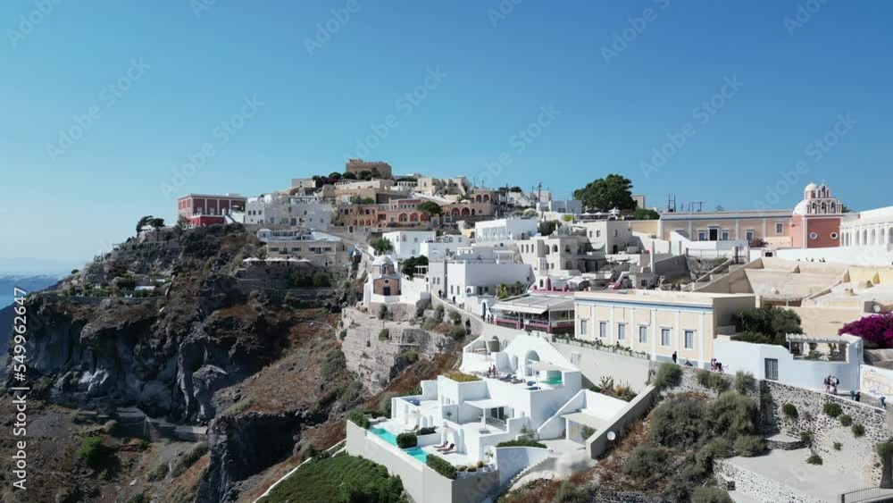Drone pull away shot of Santorini cliff houses shot early in the morning. With Cable Cars defending cliff, Santorini Greece Drone pull away shot of Santorini cliff houses shot early in the morning. With Cable Cars defending cliff, Santorini Greece