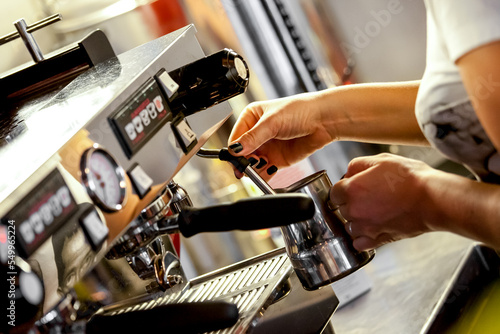 Modern coffee machine with a cup in restaurant