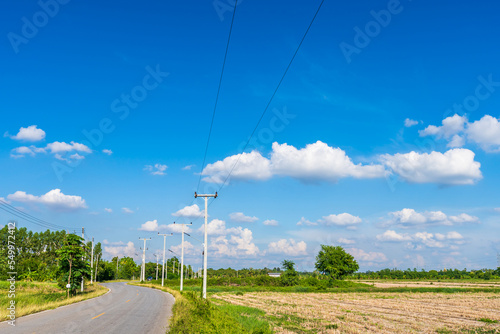 view of asphalt roads countryside Beside with spring nature and tree green in fluffy clouds blue sky daylight background.