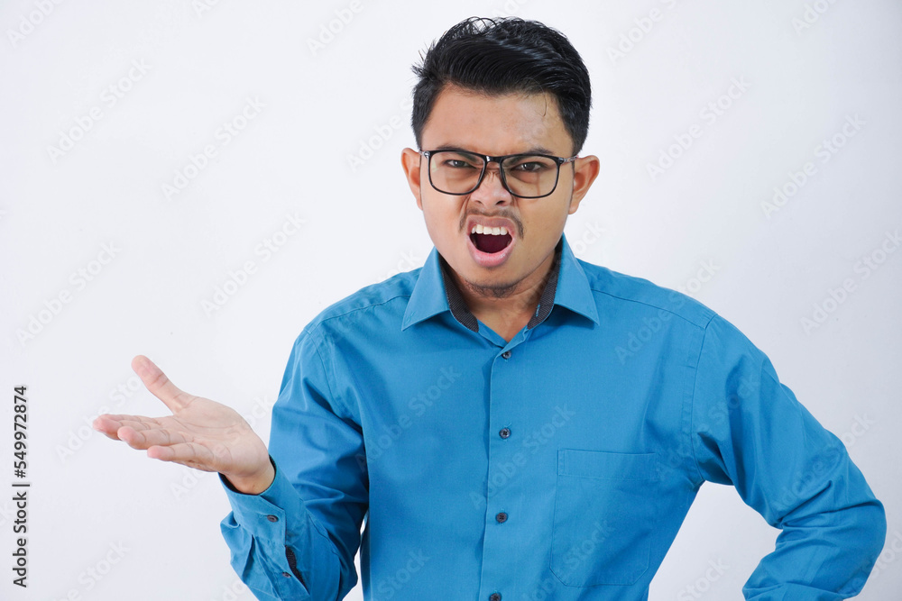 confused or amazed handsome young asian man with glasses in wearing shirt shrugging hands sideways and looking disappointed isolated on white background