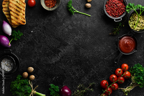 background of cooking. Spices and vegetables. Top view. Free space for your text.