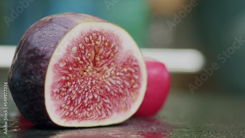 Close-up of slicing a fresh fig. photo