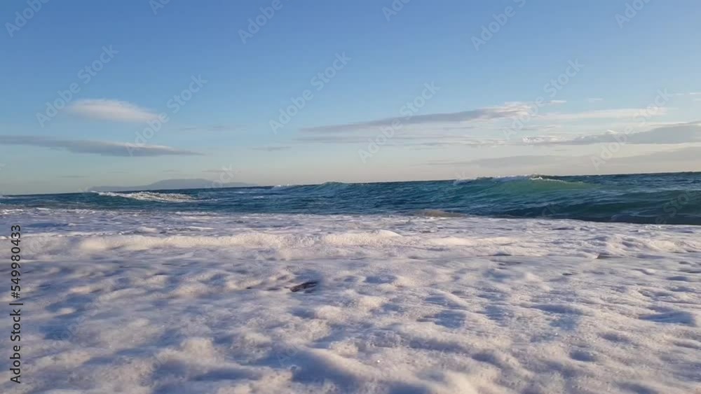 Beautiful blue turbulent Mediterranean sea and beach with fine sand Beautiful blue turbulent Mediterranean sea and beach with fine sand