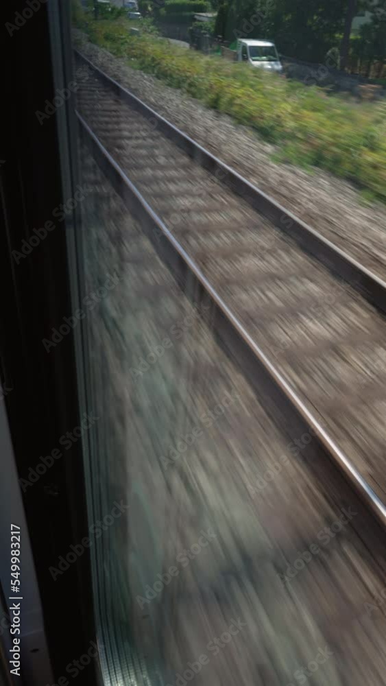Railroad train tracks in motion. High speed transportation railway track in Vertical Video Railroad train tracks in motion. High speed transportation railway track in Vertical Video