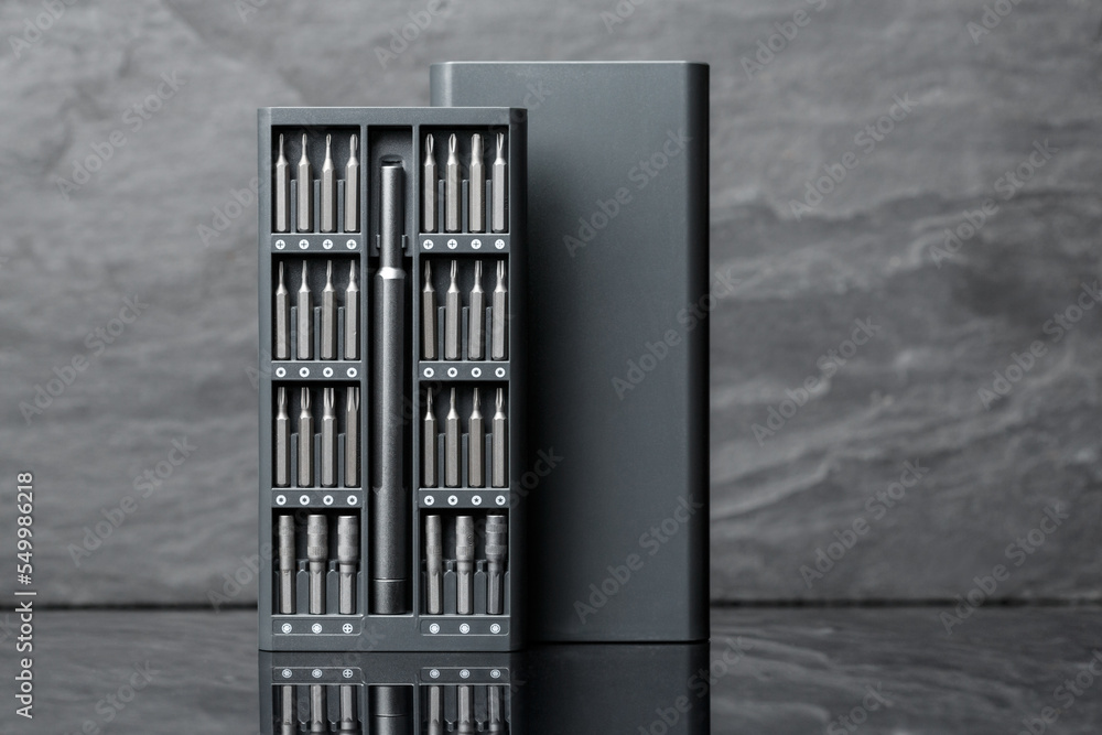 Set of metal bits and ddapters for screwdriver. Houshold screwdriver toolkit. Set of metal bits and ddapters for screwdriver. Houshold screwdriver toolkit.
