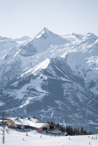 High quality landscape photo of Austrian mountain range with blue sky. Image of mountain peak covered in snow.