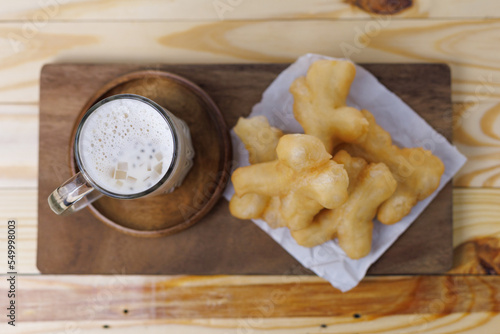 Patongo and soy milk served on the table photo