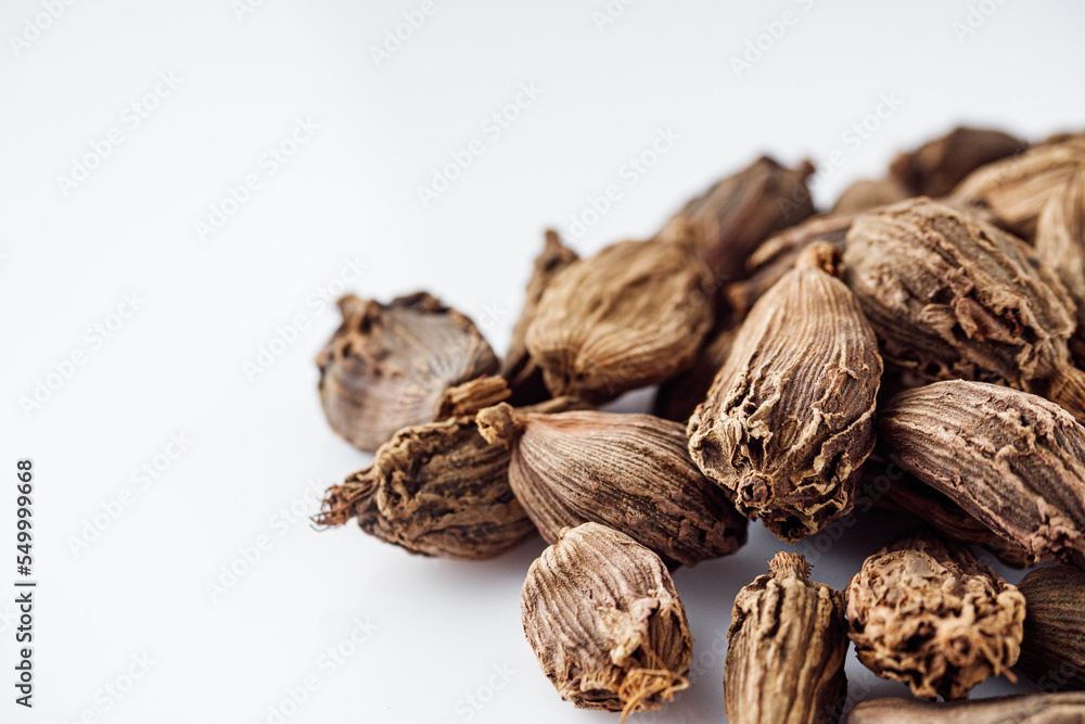 barrel dried black cardamom on a white background barrel dried black cardamom on a white background