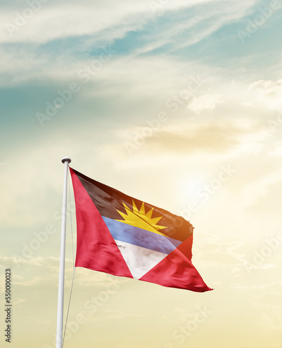 Waving Flag of Antigua and Barbuda with beautiful Sky. 