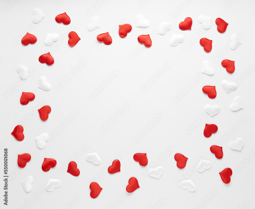 Red and white silk hearts isolated on white background. Valentine's day or Wedding romantic concept, top view, copy space, flat lay Red and white silk hearts isolated on white background. Valentine's day or Wedding romantic concept, top view, copy space, flat lay