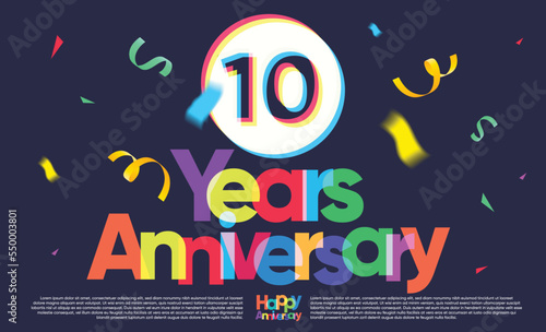colorful ten years anniversary greeting message on dark background  exploding confetti