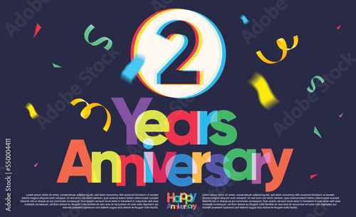 colorful two years anniversary greeting message on dark background, exploding confetti