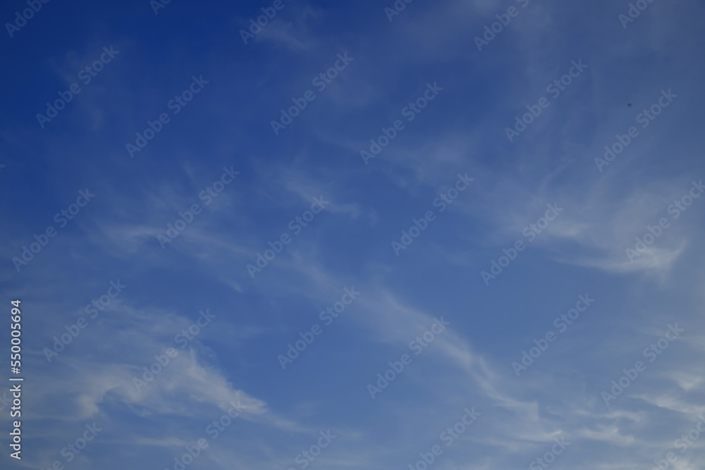 Blue sky cirrus clouds.