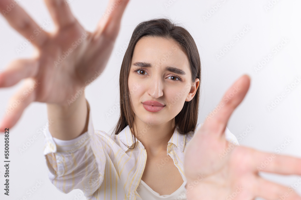 Portrait of attractive young woman wants to hug you, isolated on grey background. Portrait of attractive young woman wants to hug you, isolated on grey background.