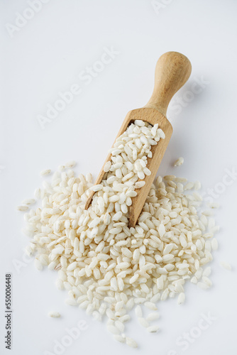 arborio rice for risotto on a white acrylic background photo