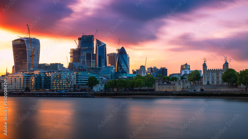 Panorama of London cityscape financial district at sunset with dramatic sky