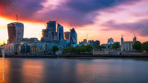 Panorama of London cityscape financial district at sunset with dramatic sky photo