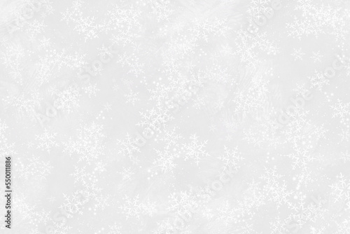 Gray winter background. Winter texture with snowflakes. Gray background with snow.