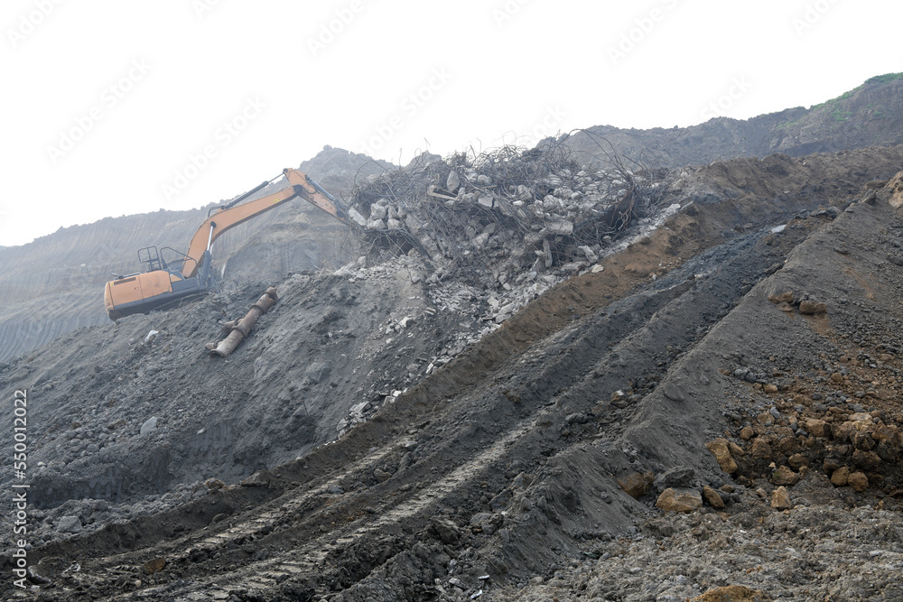 A bulldozer that removes construction waste at a surface coal mine. Bulldozer during its operation.