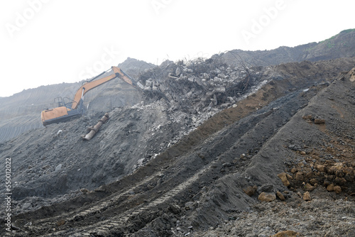 A bulldozer that removes construction waste at a surface coal mine. Bulldozer during its operation.
