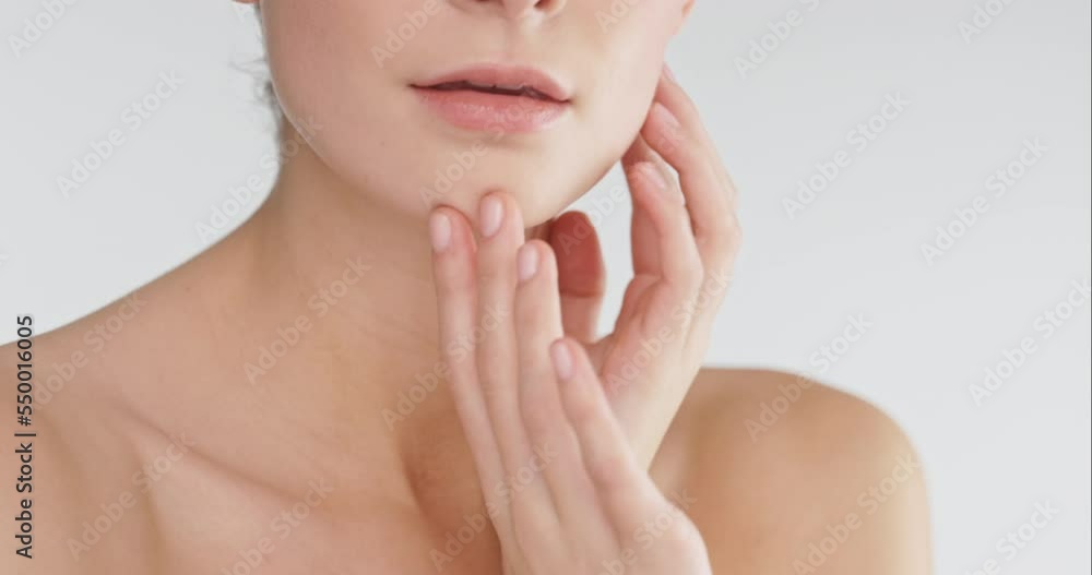 Face, skincare and beauty with a model woman in studio on a gray background with marketing mockup. Portrait, skin and cosmetics with a female posing to promote a product on advertising space Face, skincare and beauty with a model woman in studio on a gray background with marketing mockup. Portrait, skin and cosmetics with a female posing to promote a product on advertising space