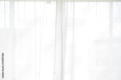 white curtain wavy with a pattern background. transparent curtain on the window