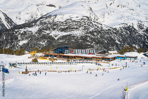 Winter sports and family ski holiday, view on Soldeu ski lifts cross centre with snowy mountains in background, Grandvalira, Andorra, Pyrenees