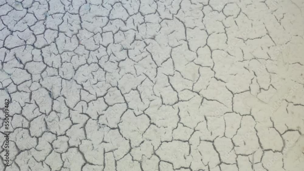 Aerial view of drought on river bed taken from drone in England. Climate change and water shortage in the UK 4K Aerial view of drought on river bed taken from drone in England. Climate change and water shortage in the UK 4K
