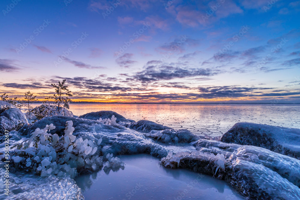 Sunset over the frozen sea. Pörkenäs, Finland