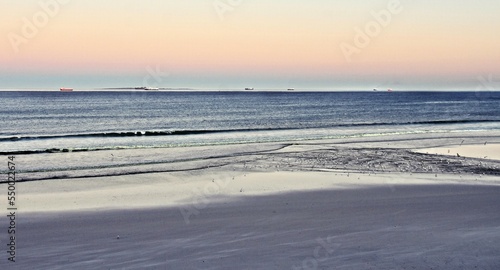 Landscape with a beautiful sunrise on the beach in Milnerton