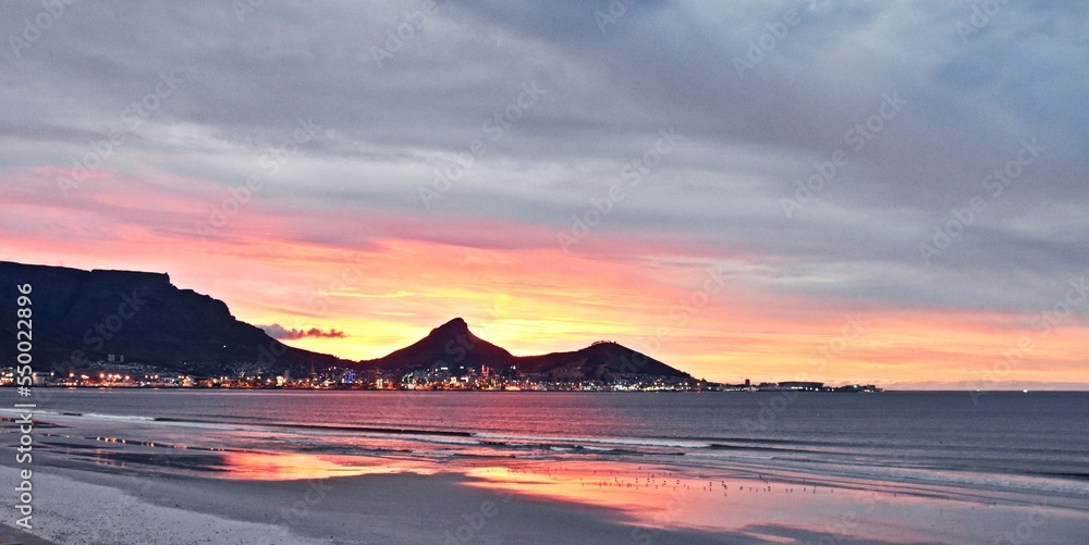 Landscape with the beach in Milnerton and Table Mountain in evening light