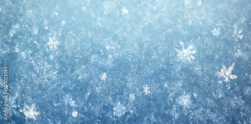 Snow in winter close-up. Macro image of snowflakes, winter background. Nice background on the theme of winter, christmas, new year. Frost Winter texture iced surface,.