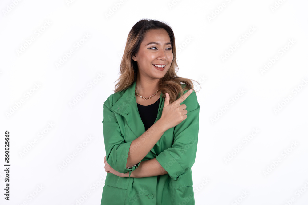 Smiling beautiful Asian woman pointing finger upward to empty space in studio white isolated background. Smiling beautiful Asian woman pointing finger upward to empty space in studio white isolated background.