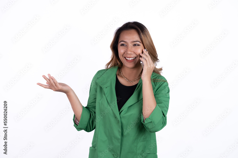 Studio shot of beautiful business asian woman holding smartphone and smiling on light white background. Studio shot of beautiful business asian woman holding smartphone and smiling on light white background.
